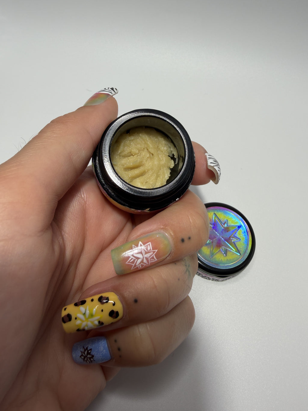 Starters Hash Rainbow Guava jar held in hand